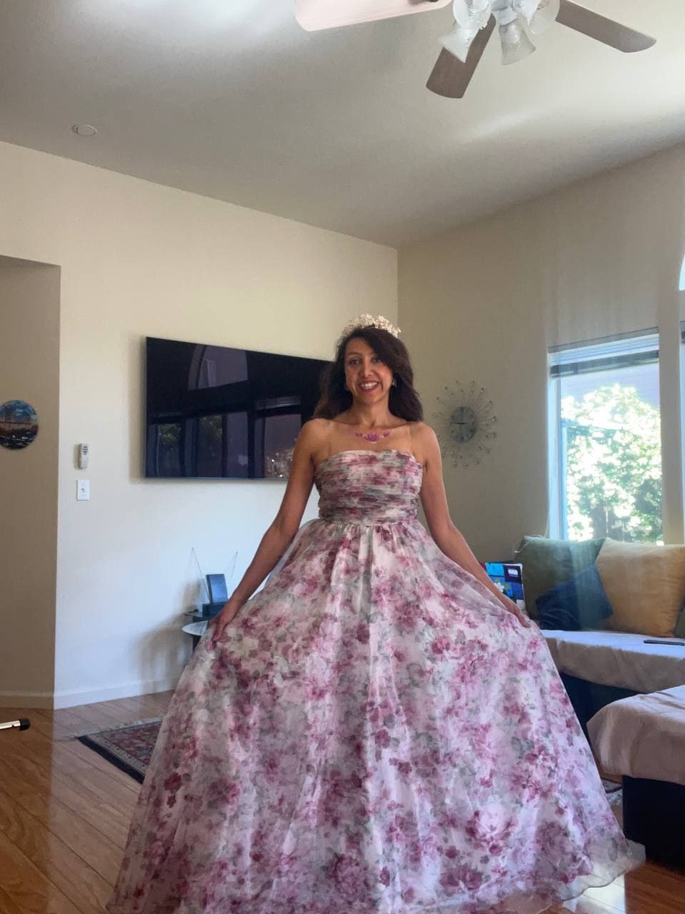 Cinderella princess character in a floral ball gown and tiara at a birthday party in the Bay Area