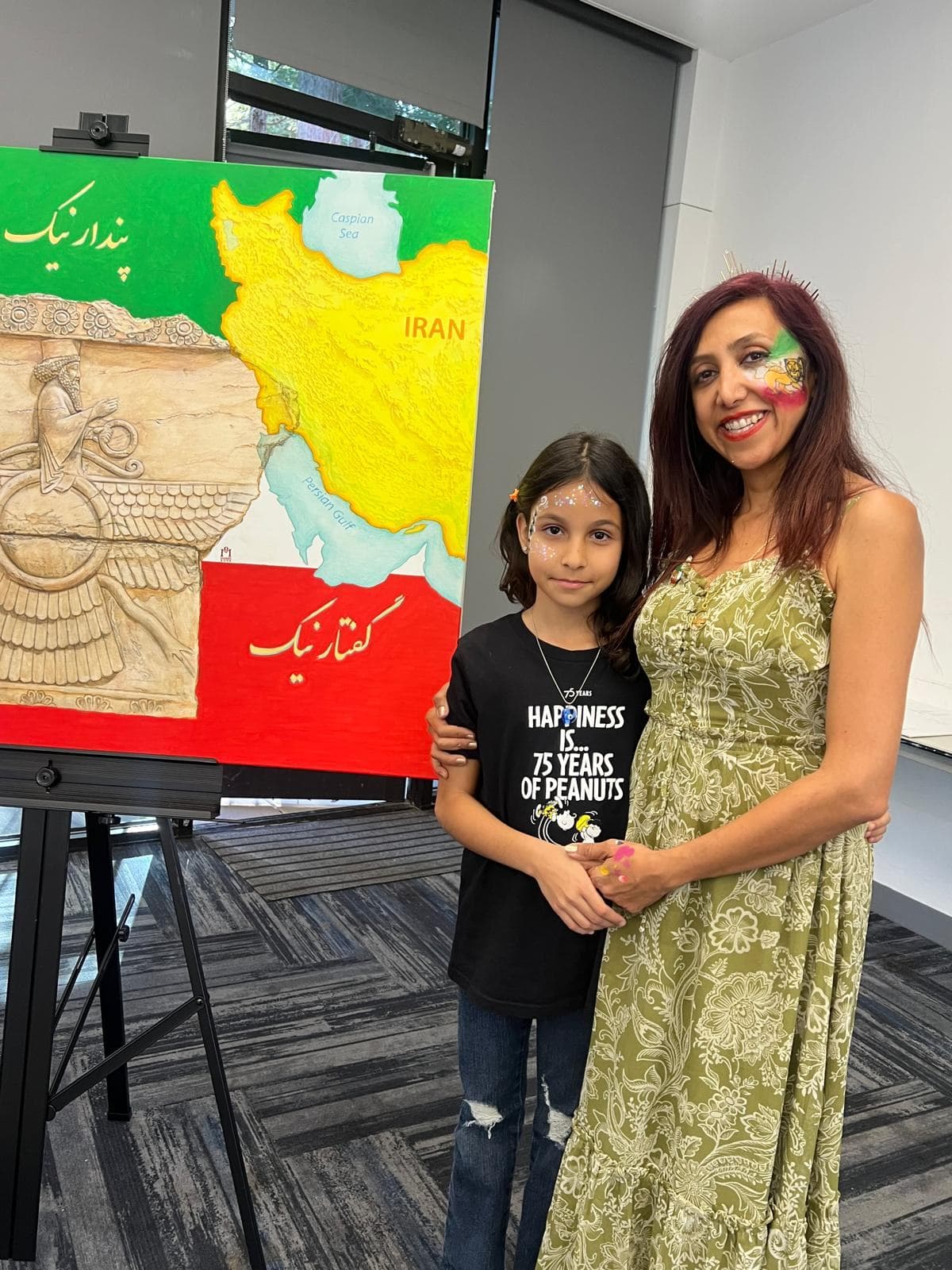 Face painting at a Persian Nowruz celebration with traditional haft-sin art